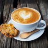 cup of coffee cup of coffee and cookie in coffee shop vintage color